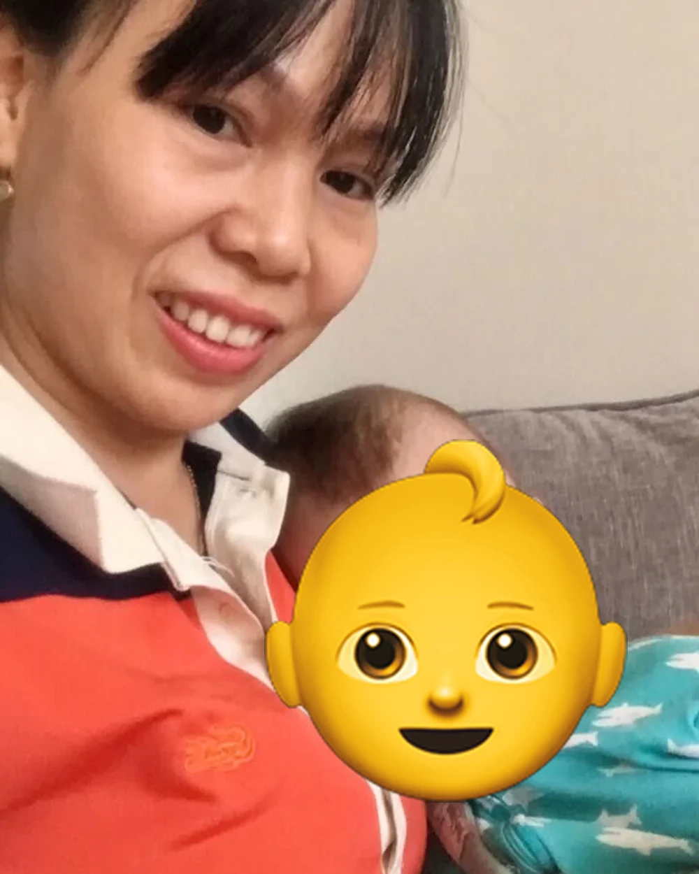 Trang with a baby she cares for in Hoi An